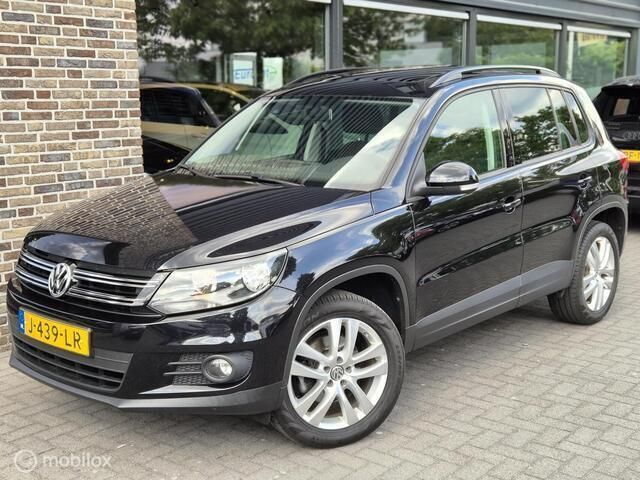 Zwart Gebruikt 2012 VW Tiguan Comfortline SUV | € 9.450 (Eerlijke prijs) - Afbeelding 1/4