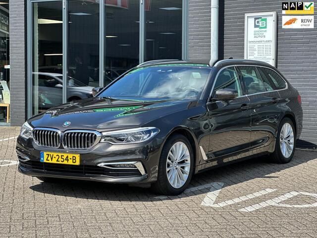 Bruin Gebruikt 2019 BMW 520 Executive Stationwagen | € 24.995 (Goede deal) - Afbeelding 1/4