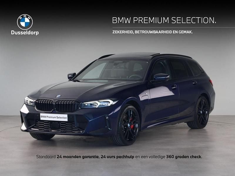 Bmw individual tansanit metallic (donker blauw metallic) Gebruikt 2024 BMW 330e Comfort Edition Stationwagen | € 51.950 (Goede deal) - Afbeelding 1/4