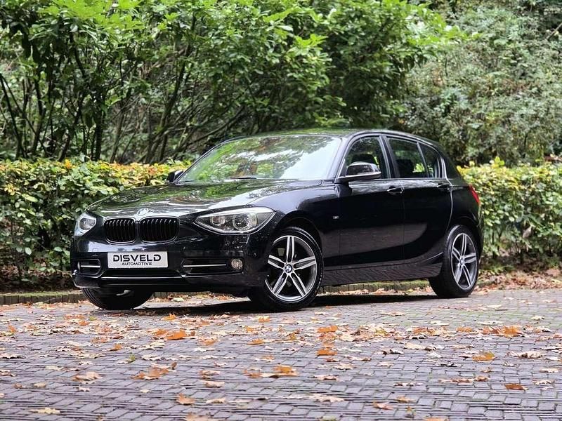 Zwart Gebruikt 2012 BMW 118 Sport Line Hatchback | € 7.250 (Eerlijke prijs) - Afbeelding 1/4