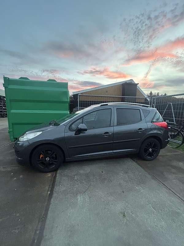 Grijs Gebruikt 2009 Peugeot 207 Stationwagen | € 999 (Goede deal) - Afbeelding 1/4