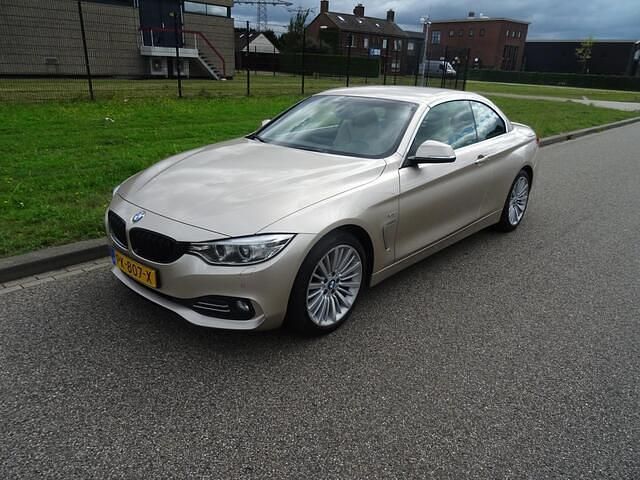 Grijs Gebruikt 2014 BMW 420 Executive Cabriolet | € 16.900 (Eerlijke prijs) - Afbeelding 1/4