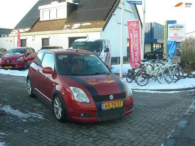Oranje Occasion 2007 Suzuki Swift Exclusive Hatchback | € 1.499 (Eerlijke prijs) - Afbeelding 1/4