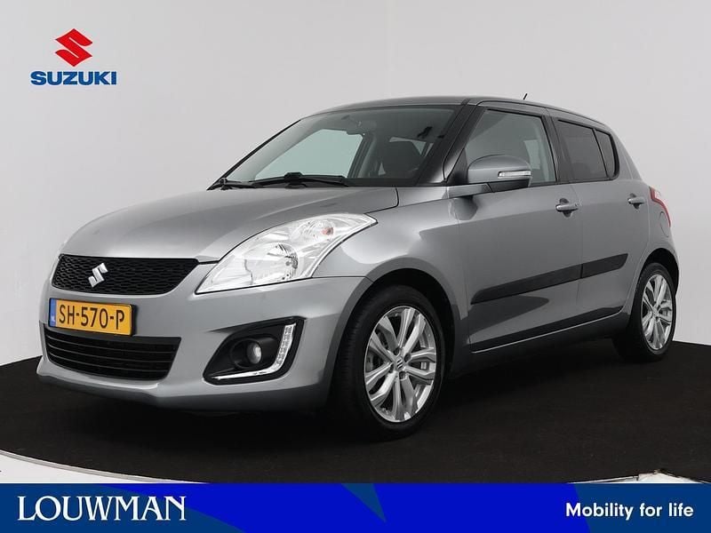 Grijs Gebruikt 2015 Suzuki Swift Exclusive Hatchback | € 12.445 (Eerlijke prijs) - Afbeelding 1/3
