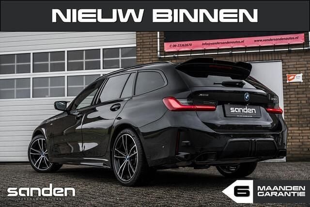 Occasion BMW 330 Basis 291 PK (214 kW) 2023 Zwart Stationwagen