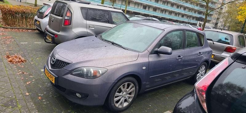 Grijs Gebruikt 2006 Mazda 3 Touring Hatchback | € 2.400 (Eerlijke prijs) - Afbeelding 1/4