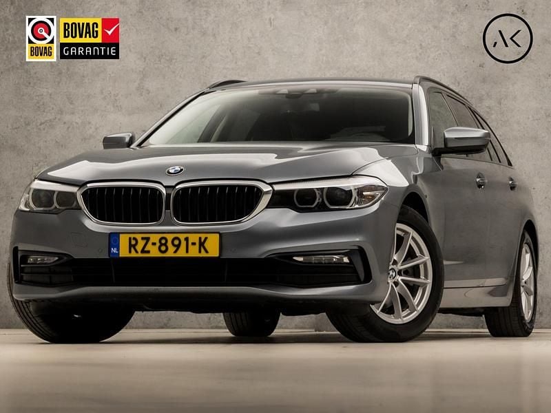 Grijs Gebruikt 2018 BMW 520 Executive Stationwagen | € 20.445 (Goede deal) - Afbeelding 1/4