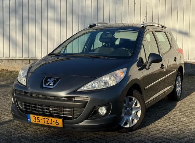 Grijs Gebruikt 2012 Peugeot 207 Active Stationwagen | € 3.449 (Eerlijke prijs) - Afbeelding 1/4