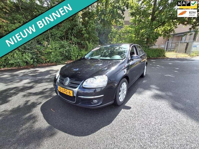Zwart, metallic lak Gebruikt 2010 VW Jetta Comfortline Sedan | € 1.799 (Eerlijke prijs) - Afbeelding 1/4