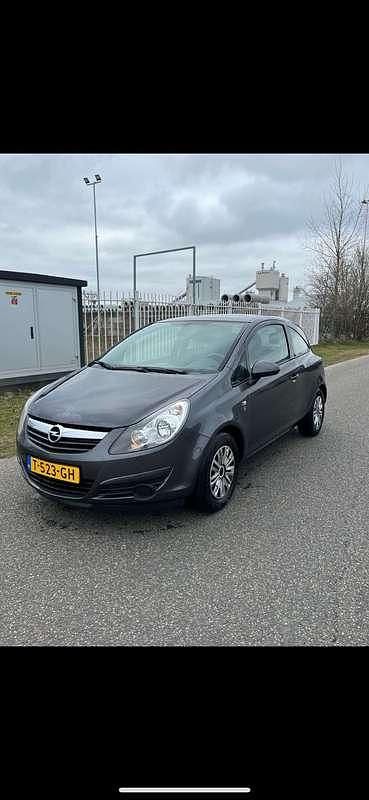 Grijs Gebruikt 2010 Opel Corsa Selection MPV | € 2.750 (Eerlijke prijs) - Afbeelding 1/4