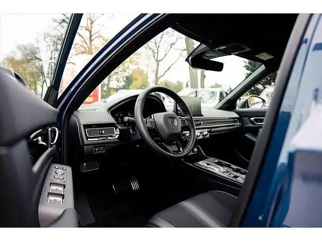Nieuw Honda Civic Hybrid 143 PK (105 kW) 2025 Blauw (metallic) Hatchback