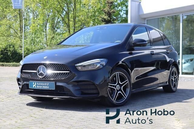 Zwart Gebruikt 2022 Mercedes E250 AMG MPV | € 30.950 (Eerlijke prijs) - Afbeelding 1/4