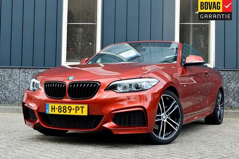 Oranje, metallic lak Gebruikt 2020 BMW 218 Executive Cabriolet | € 32.950 (Duur) - Afbeelding 1/4