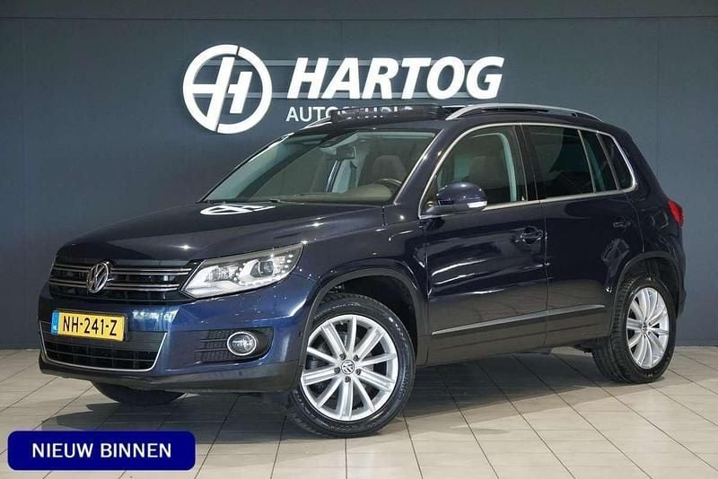 Blauw, metallic lak Gebruikt 2014 VW Tiguan Sport SUV | € 13.450 (Eerlijke prijs) - Afbeelding 1/4
