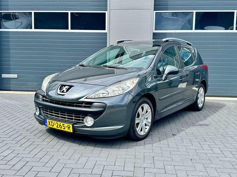 Grijs Gebruikt 2009 Peugeot 207 Stationwagen | € 1.699 (Goede deal) - Afbeelding 1/3