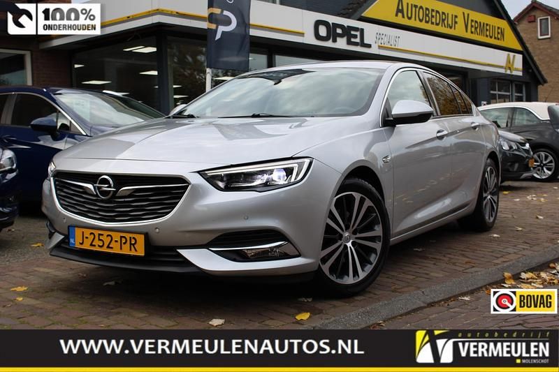 Grijs (metallic) Gebruikt 2020 Opel Insignia Business Hatchback | € 16.950 (Eerlijke prijs) - Afbeelding 1/4