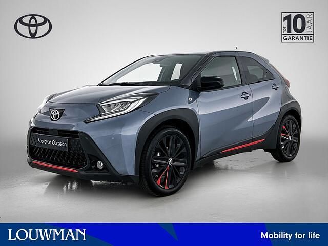 Blauw metallic Gebruikt 2023 Toyota Aygo X Envy SUV | € 23.950 - Afbeelding 1/4