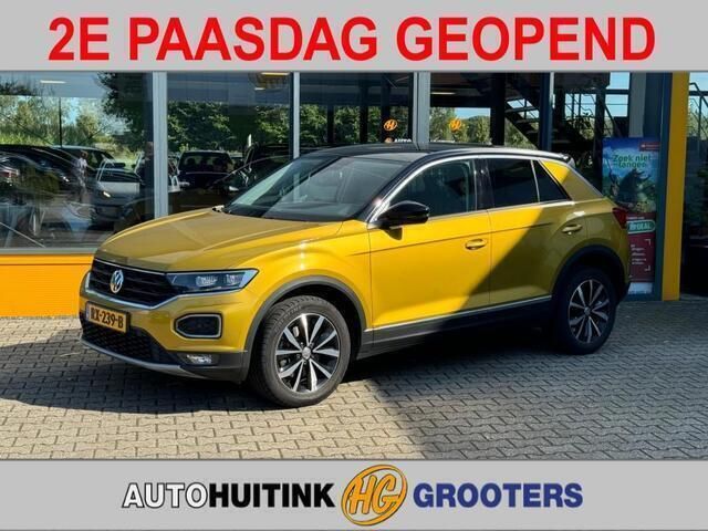 Goud, metallic lak Gebruikt 2018 VW T-Roc Style SUV | € 18.945 (Eerlijke prijs) - Afbeelding 1/4