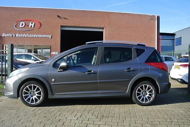 Grijs Occasion 2008 Peugeot 207 Outdoor Outdoor Stationwagen | € 1.499 (Eerlijke prijs) - Afbeelding 1/4
