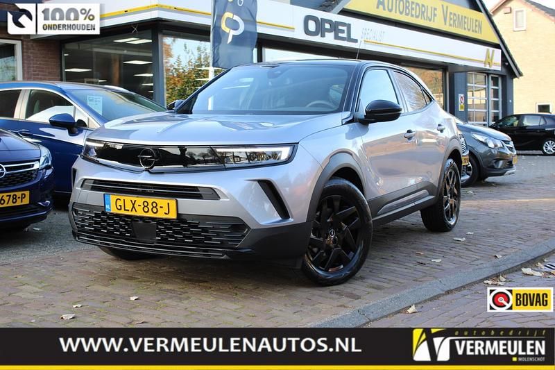Grijs (metallic) Gebruikt 2024 Opel Mokka SUV | € 25.750 - Afbeelding 1/4