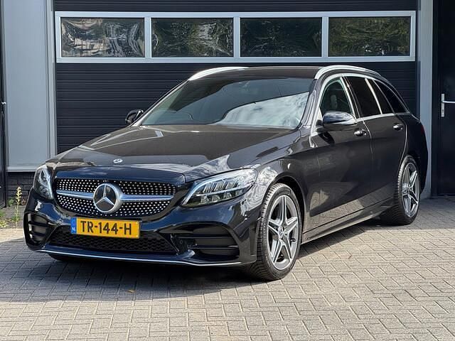 Zwart Gebruikt 2018 Mercedes C180 AMG Stationwagen | € 17.950 (Eerlijke prijs) - Afbeelding 1/4