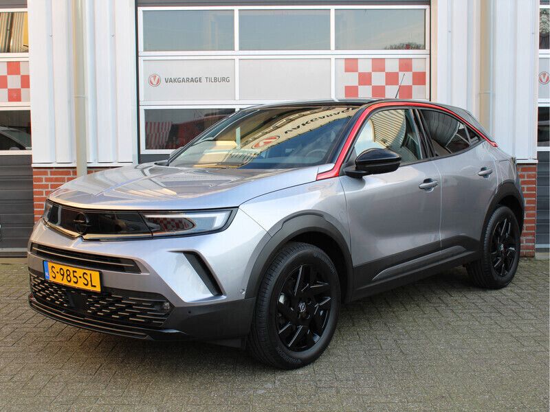 Grijs Gebruikt 2023 Opel Mokka SUV | € 21.950 (Eerlijke prijs) - Afbeelding 1/4