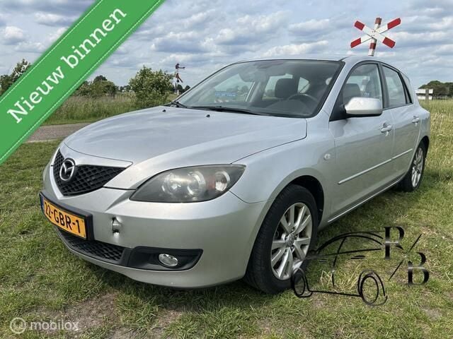 Grijs, metallic lak Gebruikt 2008 Mazda 3 Touring Hatchback | € 1.799 (Eerlijke prijs) - Afbeelding 1/4