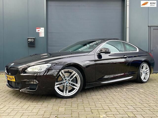 Zwart (metallic) Gebruikt 2012 BMW 650 Executive Coupé | € 24.994 (Eerlijke prijs) - Afbeelding 1/4