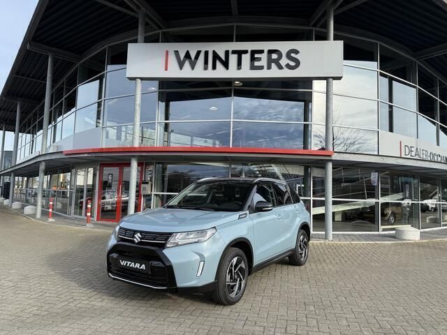 Blauw Nieuw 2025 Suzuki Vitara Style SUV | € 35.292 (Eerlijke prijs) - Afbeelding 1/4