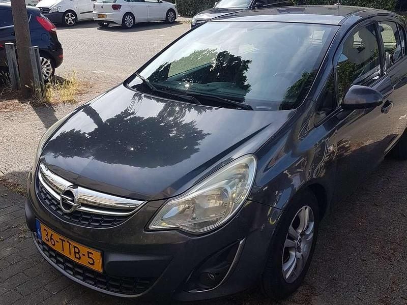 Grijs Gebruikt 2012 Opel Corsa S MPV | € 2.000 (Eerlijke prijs) - Afbeelding 1/4