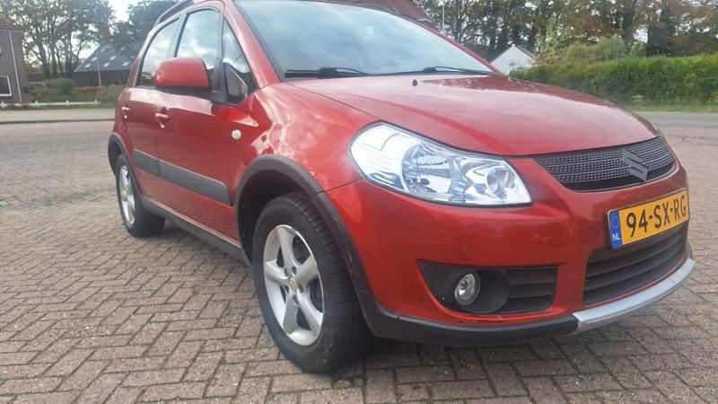 Oranje Occasion 2006 Suzuki SX4 Exclusive MPV | € 2.500 (Eerlijke prijs) - Afbeelding 1/4