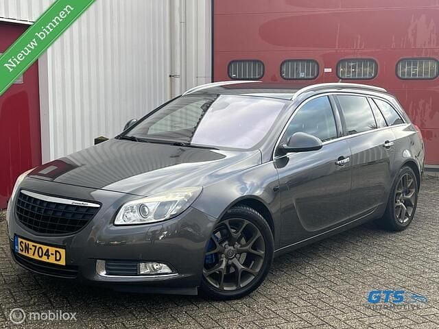 Grijs (parellak) Gebruikt 2010 Opel Insignia Cosmo Stationwagen | € 7.250 (Eerlijke prijs) - Afbeelding 1/4