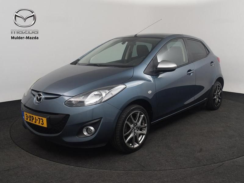 Blue reflex (blauw metallic) Gebruikt 2014 Mazda 2 Edition Hatchback | € 8.950 (Goede deal) - Afbeelding 1/4