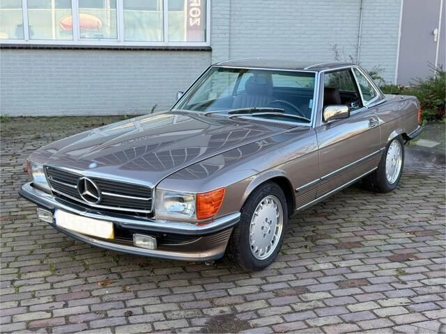 Bruin Gebruikt 1988 Mercedes 560 | € 42.950 - Afbeelding 1/4