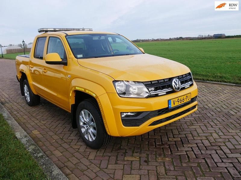 Geel Occasion 2018 VW Amarok Comfortline Pickup | € 12.999 (Eerlijke prijs) - Afbeelding 1/2
