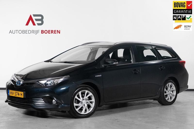 Grijs Gebruikt 2015 Toyota Auris Hybrid Stationwagen | € 12.295 (Eerlijke prijs) - Afbeelding 1/4