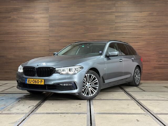 Grijs Gebruikt 2018 BMW 520 Executive Stationwagen | € 25.890 (Goede deal) - Afbeelding 1/4