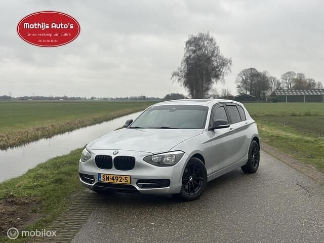 Grijs Occasion 2012 BMW 120 Basis Hatchback | € 6.750 (Eerlijke prijs) - Afbeelding 1/4