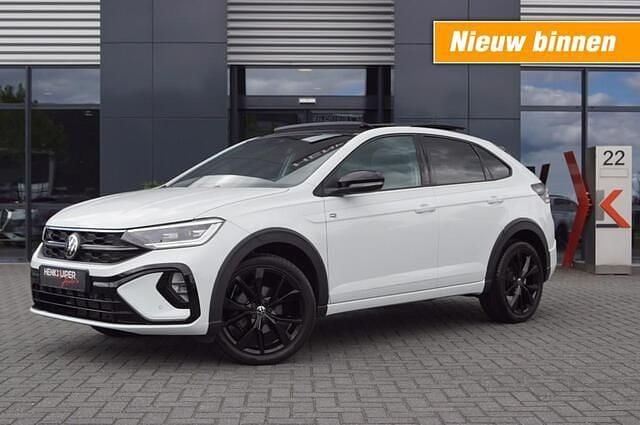Wit Gebruikt 2024 VW Taigo Design SUV | € 35.950 - Afbeelding 1/4
