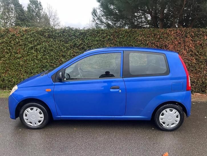 Occasion Daihatsu Cuore 59 PK (43 kW) 2008 Blauw (metallic) Hatchback