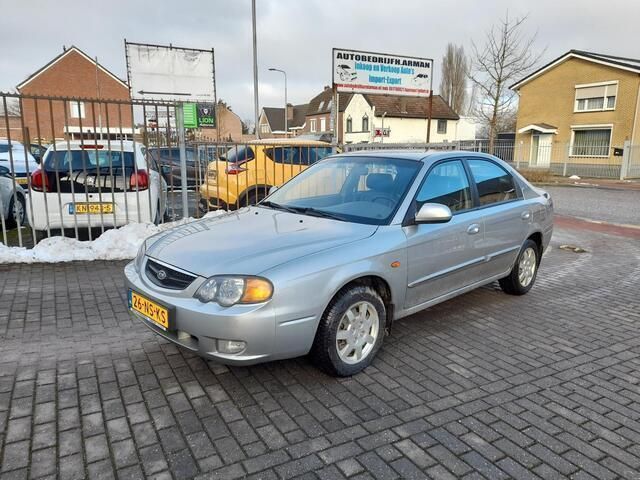Grijs Gebruikt 2004 Kia Shuma Sedan | € 2.950 - Afbeelding 1/4