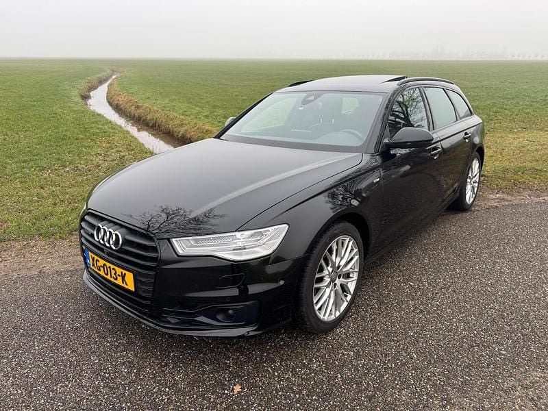 Zwart (metallic) Occasion 2015 Audi A6 Premium Stationwagen | € 26.950 (Super prijs) - Afbeelding 1/4
