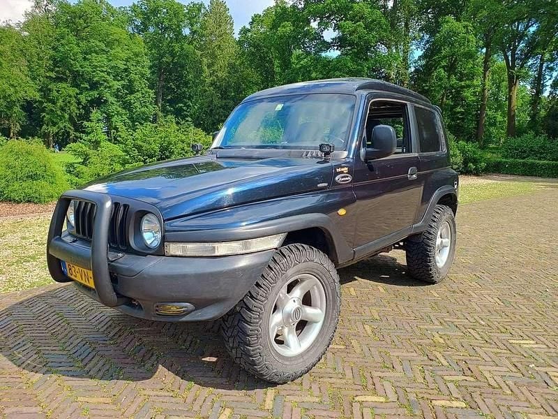 Blauw Gebruikt 2000 Ssangyong (KGM) Korando SUV | € 6.500 - Afbeelding 1/4
