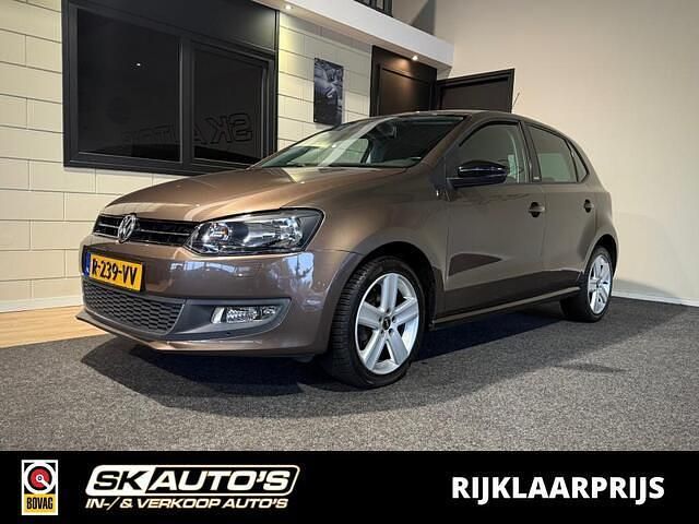 Bruin (metallic) Occasion 2012 VW Polo Trendline Hatchback | € 7.995 (Duur) - Afbeelding 1/4