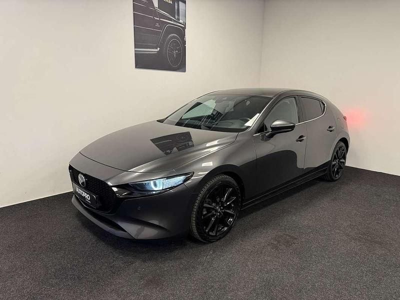Grijs Gebruikt 2020 Mazda 3 Luxury Hatchback | € 19.990 (Eerlijke prijs) - Afbeelding 1/4
