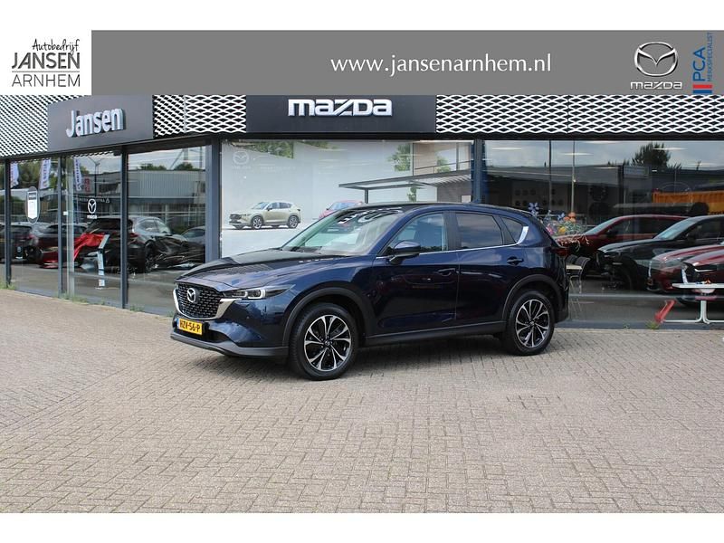 Deep crystal blue mica (42m) (donker blauw) Gebruikt 2022 Mazda CX-5 Ad'Vantage SUV | € 32.900 (Eerlijke prijs) - Afbeelding 1/4
