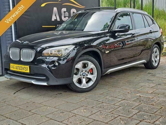 Zwart Gebruikt 2010 BMW X1 Comfort Edition SUV | € 17.995 - Afbeelding 1/4