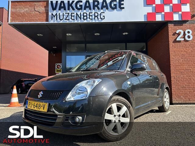 Zwart, metallic lak Gebruikt 2009 Suzuki Swift Exclusive Hatchback | € 6.945 (Eerlijke prijs) - Afbeelding 1/4