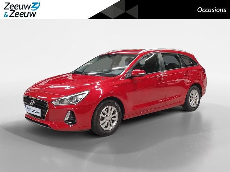 Scarlet red pearl (pr2) Gebruikt 2018 Hyundai i30 Comfort Stationwagen | € 13.950 (Eerlijke prijs) - Afbeelding 1/4