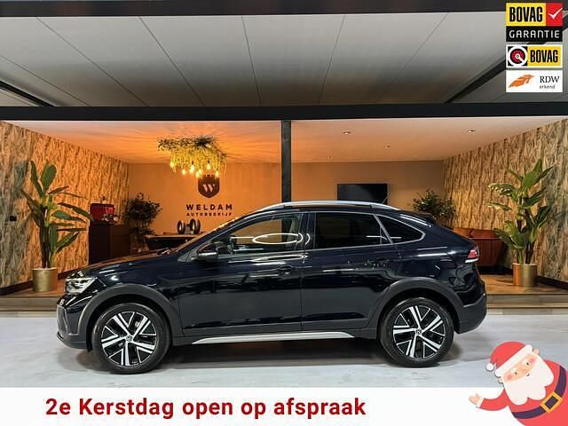 Zwart (metallic) Gebruikt 2021 VW Taigo Style SUV | € 21.990 (Eerlijke prijs) - Afbeelding 1/4